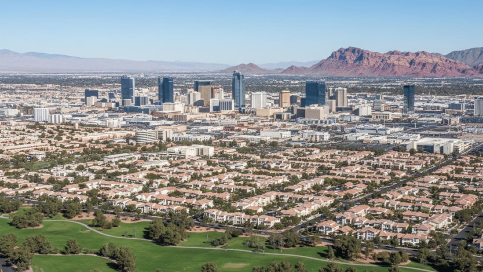 Aerial view comparing Las Vegas urban skyline with Summerlin master-planned community