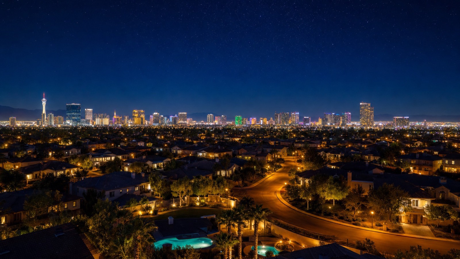 Strip-corridor luxury high-rise condo context showing the broader Las Vegas Strip skyline at night with multiple high-rise residential towers including Panorama Towers visible