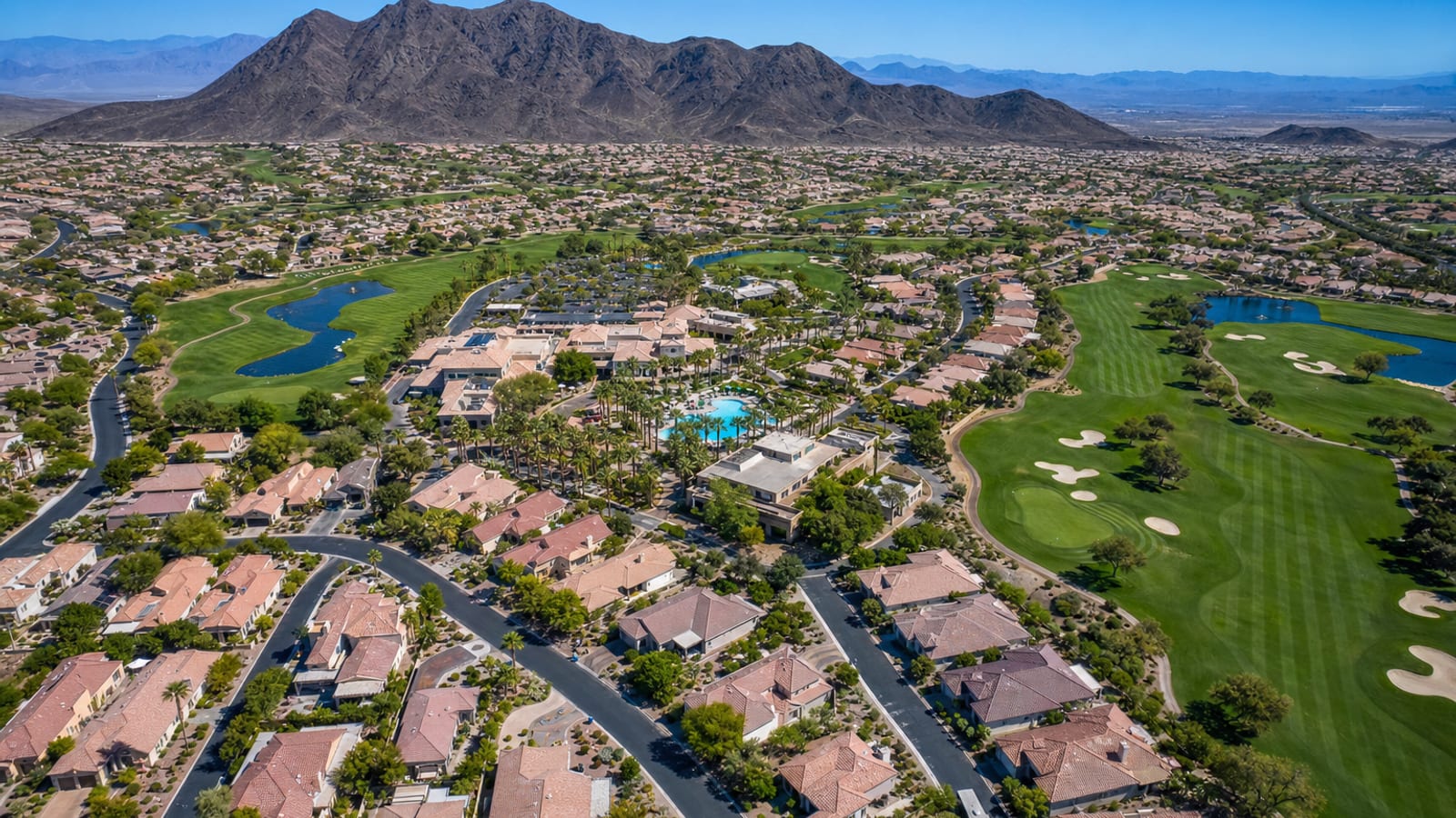 Aerial view of the Sun City Anthem 55-plus master-planned community on the Henderson hillside with single-story homes and mountain views